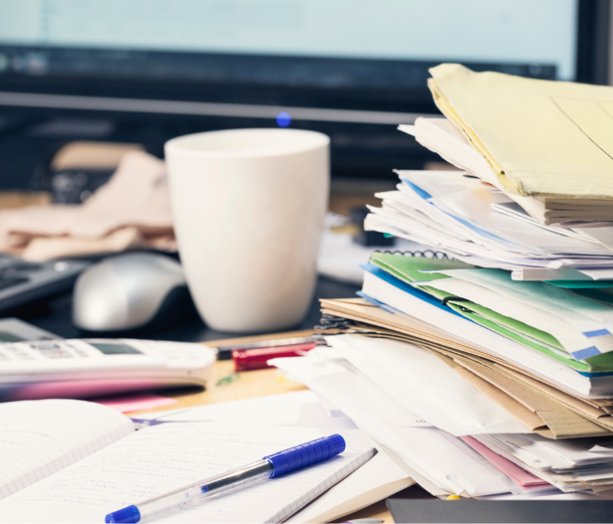 Organized desk with papers, notes, and records for preparing tax documents
